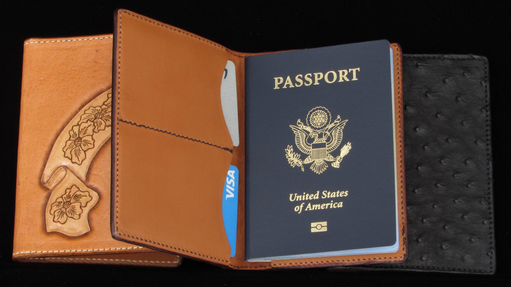 Passport holder with a United States passport inside on a black background